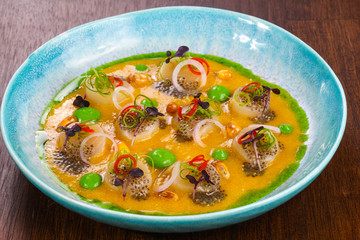 Scallops with sauce and chili