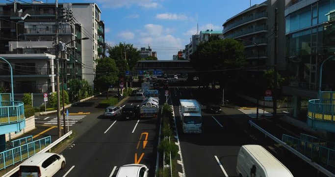 A downtown street at Kanpachi avenue in Tokyo daytime
