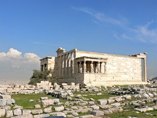 The Erechtheion Temple with blue sky in the Acropolis of Athens, Greece.