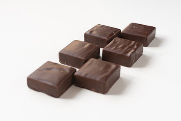 Chocolate candies on a white background.