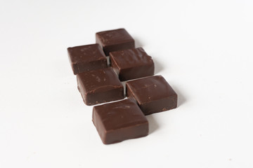 Chocolate candies on a white background.