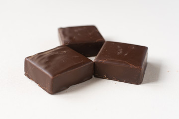 Chocolate candies on a white background.