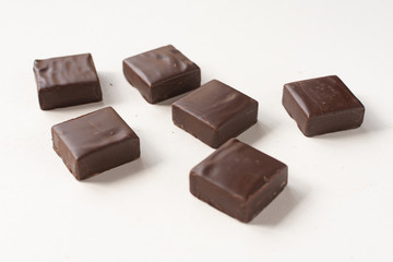 Chocolate candies on a white background.
