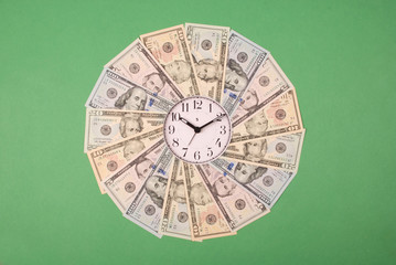 Concept of clock and dollar. Clock on mandala kaleidoscope from money. Abstract money background...
