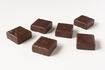 Chocolate candies on a white background.