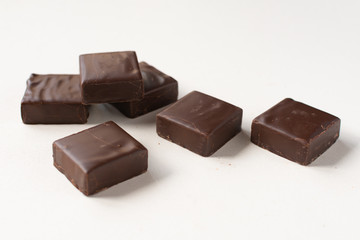 Chocolate candies on a white background.