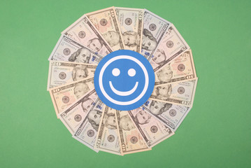Smile faces on mandala kaleidoscope from money.