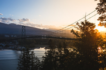 lions gate bridge during sunrise in Vancouver British Columbia Stanley park