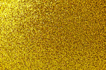 Golden glitter abstract background. Selective focus.