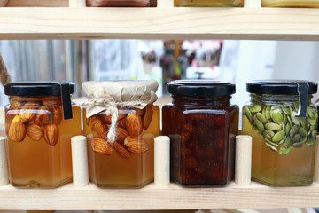 Glass jars of honey and jam