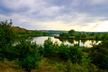 Fototapeta premium Water landscape in cloudy weather on a summer day.