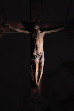 Old medieval crucifix in Italian church - made of wood