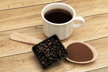 Roasted coffee beans, ground coffee, Cup of coffee, Wooden spoon with roasted coffee