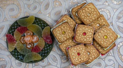 Sweets.Cookies and marmalade on a plate.