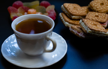 Tea with sweets. Cookies, marmalade, candies.