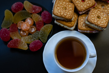 Tea with sweets. Cookies, marmalade, candies.