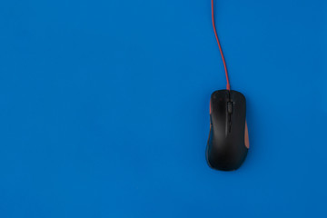 top view of the simple computer mouse on the color background with copy space, minimalist concept