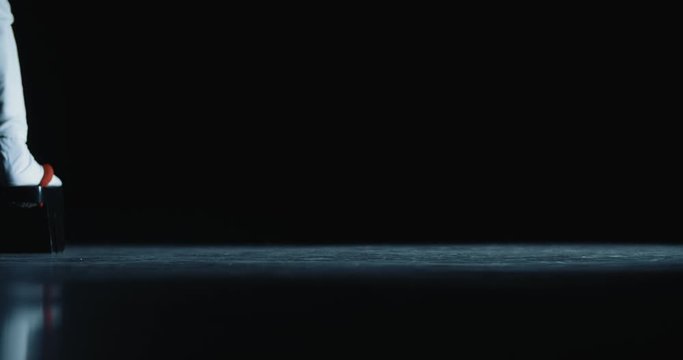 Japanese geisha in traditional kitsune costume and on geta sandals walking on stage while performing a dance - culture concept low angle close up 4k footage