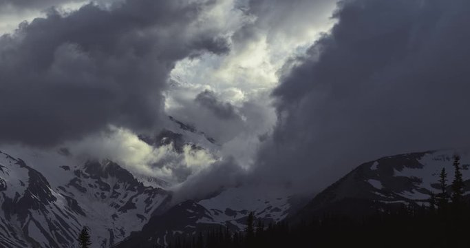4K Timelapse of Dramatic Storm and Mist on Mount Rainier at Sunset