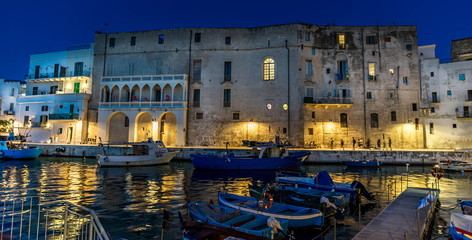 Old port of Monopoli province of Bari, region of Apulia, southern Italy. Boats in the marina of...