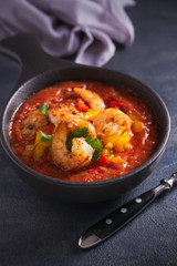 Shrimp Gazpacho with Roasted Red and Yellow Bell Peppers. Spanish pureed cold tomato soup with shrimps