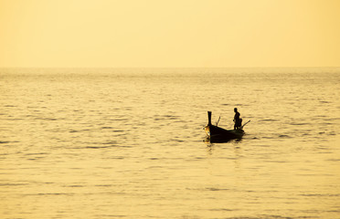 Asian fisherman returning in the evening