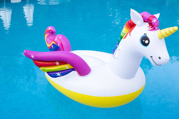Happy and bright inflatable unicorn swimming ring. Unicorn inflatable float.