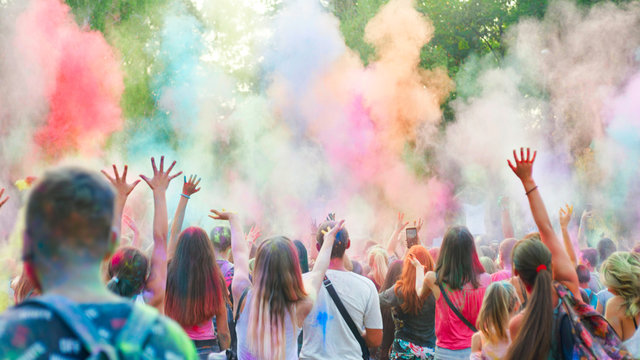 People dancing and celebrating during Music and Colors festival. Celebrants dancing during the color Holi Festival