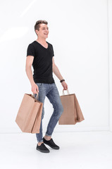 Handsome man in a black T-shirt with a bag