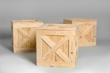 Group of wooden crates on grey background