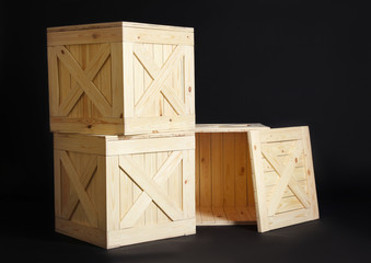 Group of wooden crates on black background
