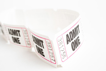 A macro or close-up shot of a strip of generic white sequentially numbered admittance ticket.
