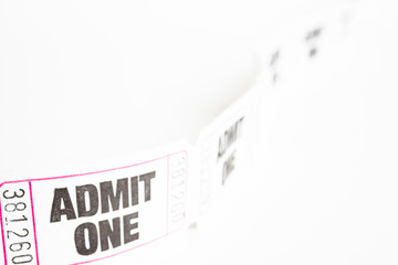 A macro or close-up shot of a strip of generic white sequentially numbered admittance ticket.