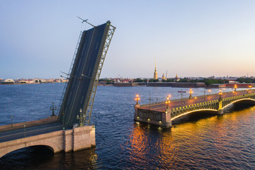 Petersburg Russia. The cargo ship passes under the bridge. Petersburg bridges. Trinity Bridge. White nights in Petersburg. Cities of Russia.