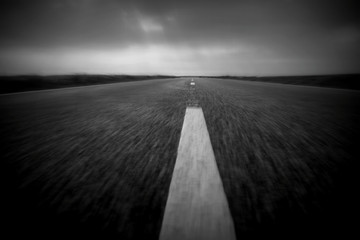 Road in black and white blurred background