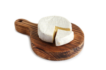 Wooden board with brie cheese on white background