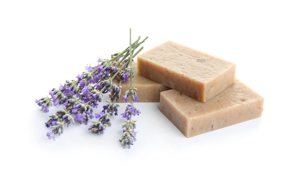 Hand made soap bars with lavender flowers on white background
