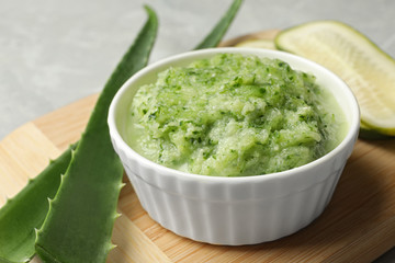 Handmade face mask and fresh ingredients on grey table, closeup