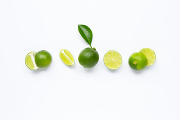 Limes with leaf isolated on white