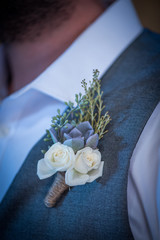 wedding boutonniere on suit of groom