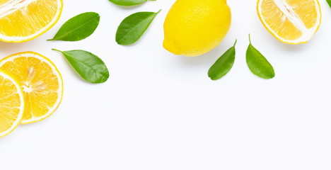 Frame made of fresh lemon and  slices with leaves isolated on white