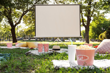 Big screen in open air cinema. Space for text