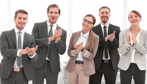 smiling business team applauds their success