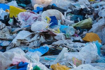 garbage dump with lot of plastic bag and bottles and other waste