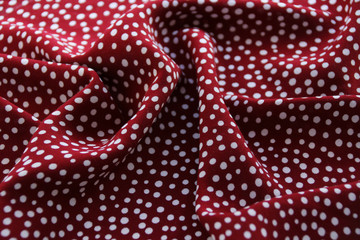 beautifully draped soft folds bright red fabric for needlework or decor, polka dot and dots...