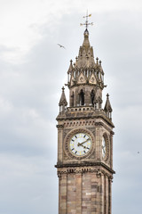 Fototapeta na wymiar Detail of the top of the The Albert Memorial Clock Tower in the City Center of Belfast, Northern Ireland, UK.