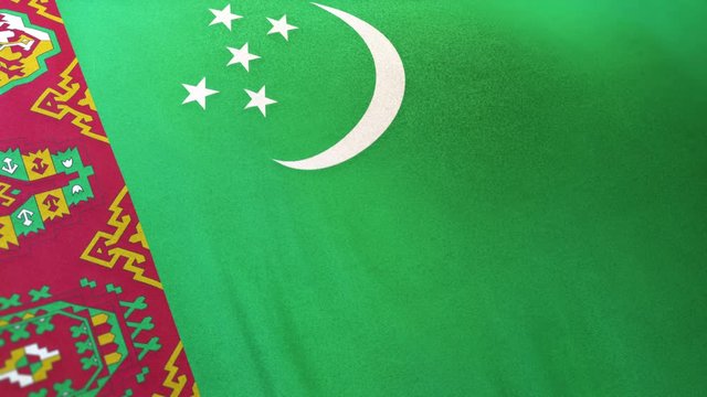Turkmenistan national flag seamlessly waving on realistic satin texture 29.97FPS