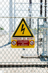 Danger de Mort sign translated as danger of death at the security fence entrance at hydroelectric power plant at Centrale Hydroelectrique de Gambsheim