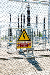 Side view of danger de Mort sign translated as danger of death at the security fence entrance at hydroelectric power plant at Centrale Hydroelectrique de Gambsheim