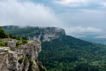 Clouds going through the mountain peak in Madara, Bulgaria